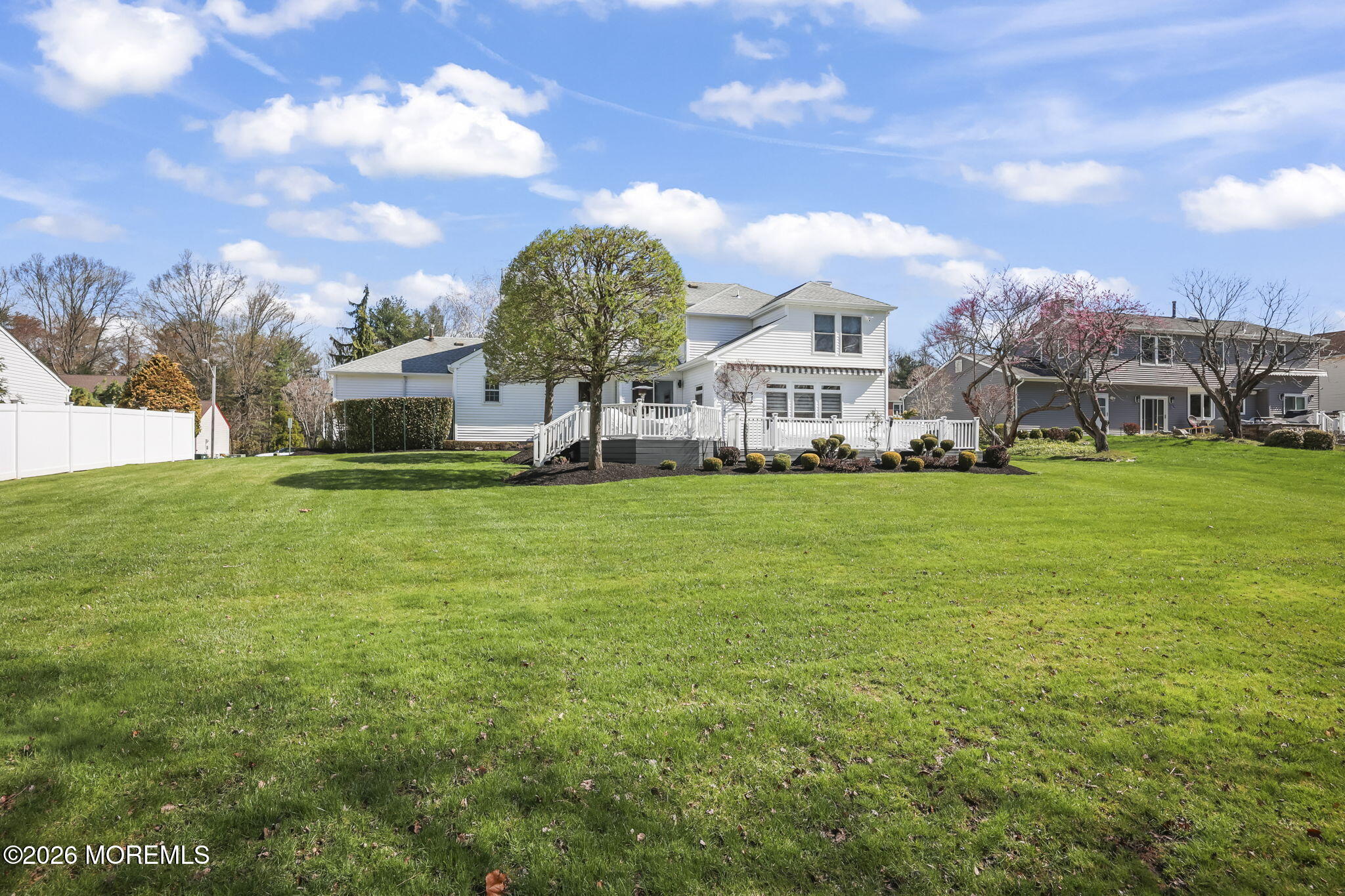20 Colts Run Marlboro, NJ 07746 - Photo 43 of 44 a view of a big yard with a house in the background