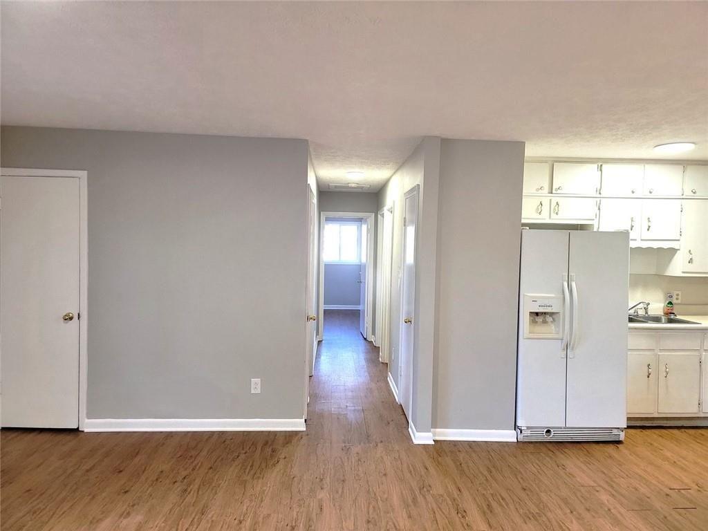 4042 Jodeco Road McDonough, GA 30253 - Photo 6 of 16 a view of a hallway with wooden floor
