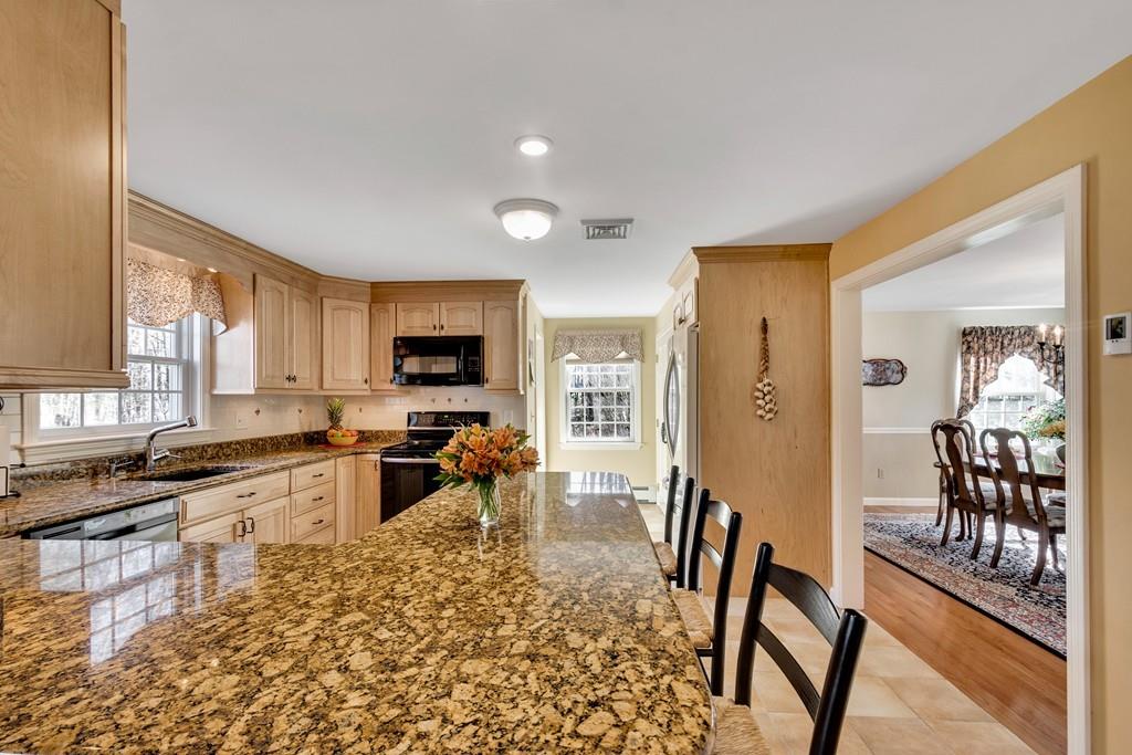 51 Parker Road Shirley, MA 01464 - Photo 13 of 39 a large living room with stainless steel appliances granite countertop a couch and a view of living room