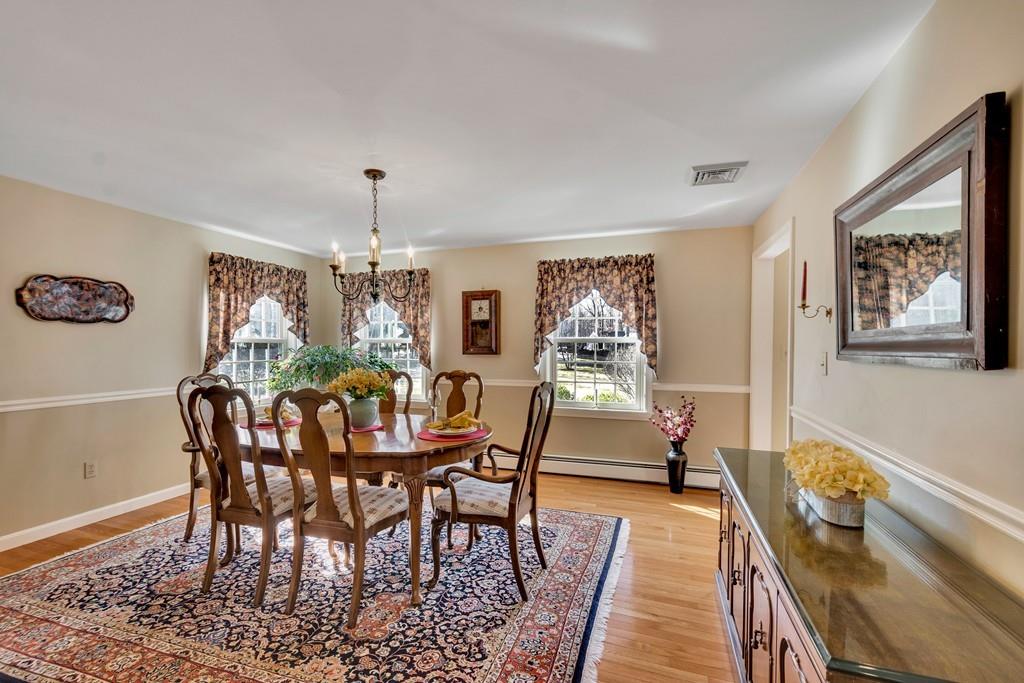51 Parker Road Shirley, MA 01464 - Photo 17 of 39 a view of a dining room with furniture window and wooden floor