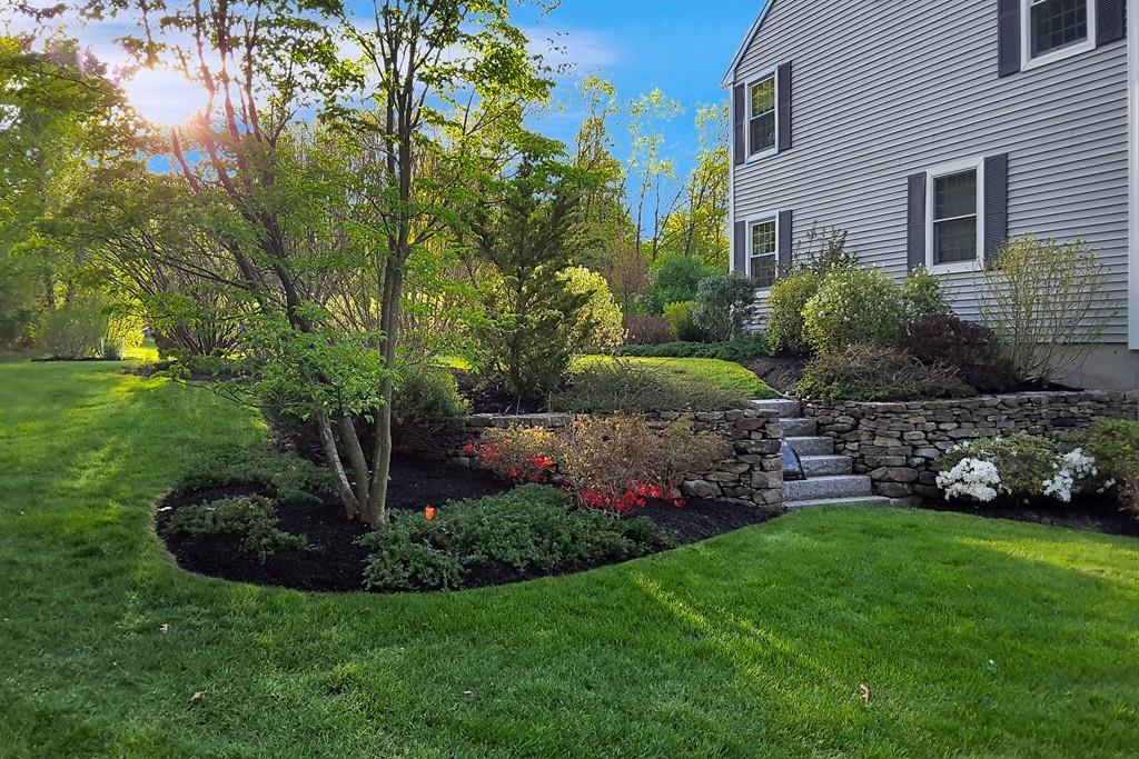 51 Parker Road Shirley, MA 01464 - Photo 34 of 39 a view of a garden with plants and large trees