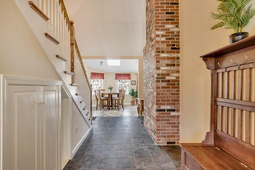 51 Parker Road Shirley, MA 01464 - Photo 4 of 39 a view of a hallway with wooden floor and staircase