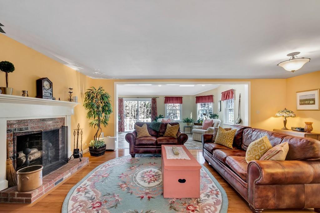 51 Parker Road Shirley, MA 01464 - Photo 9 of 39 a living room with furniture and a fireplace