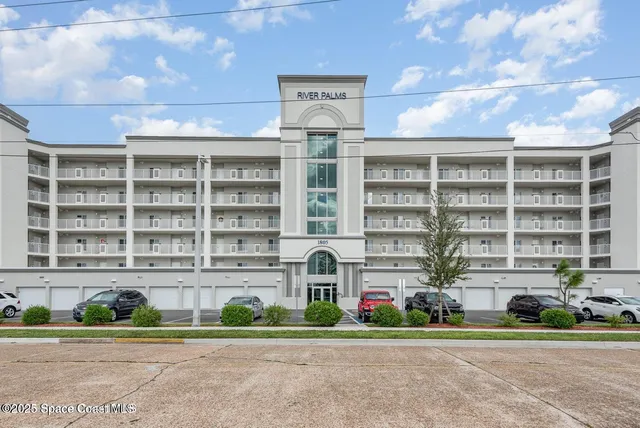 a front view of building with yard