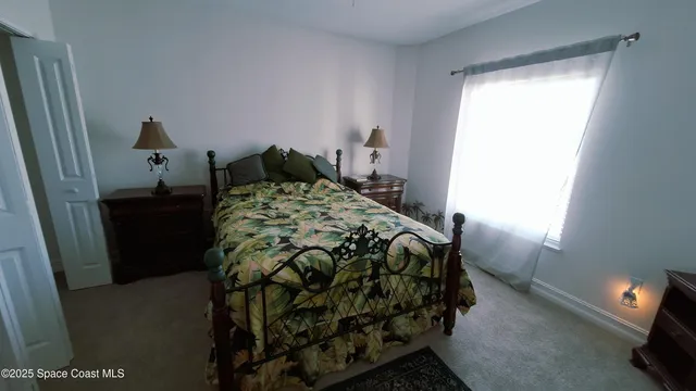 a bedroom with a bed and dresser