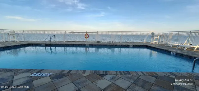 a view of a swimming pool and an ocean