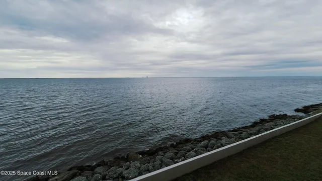 a view of swimming pool with outdoor seating