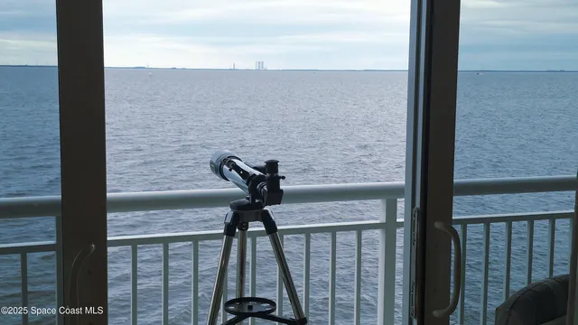 a view of kitchen with kitchen island dining table and chairs