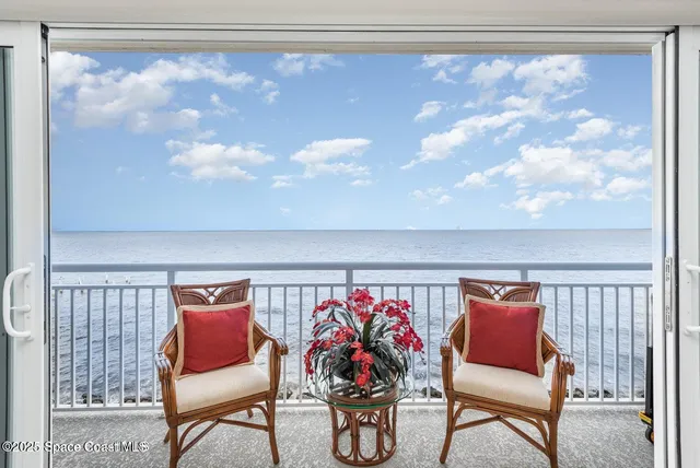 a view of a balcony with wooden floor