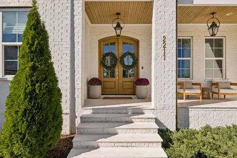 a front view of a house with a yard