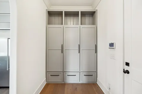 a view of walk in closet with empty racks