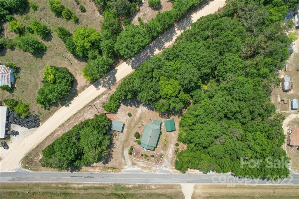 1635 State Rd S-13-61 Cheraw, SC 29520 - Photo 2 of 13 an aerial view of a house with a yard basket ball court and outdoor seating
