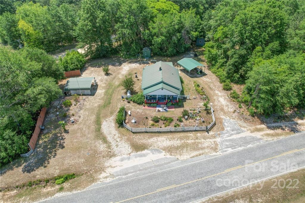1635 State Rd S-13-61 Cheraw, SC 29520 - Photo 6 of 13 an aerial view of a house with a yard and greenery