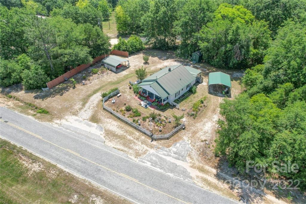 1635 State Rd S-13-61 Cheraw, SC 29520 - Photo 7 of 13 an aerial view of a house with trees all around