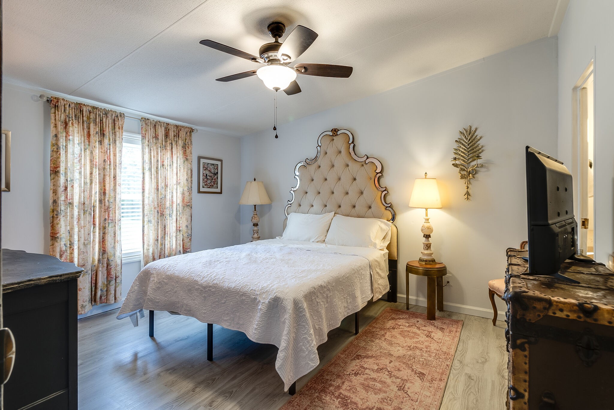 2865 Carpenter Bridge Road Columbia, TN 38401 - Photo 20 of 25 a bed room with a bed and a flat tv screen on a dresser