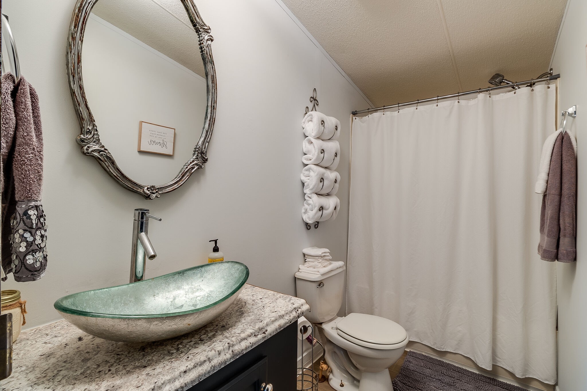 2865 Carpenter Bridge Road Columbia, TN 38401 - Photo 21 of 25 a bathroom with a granite countertop toilet and a mirror