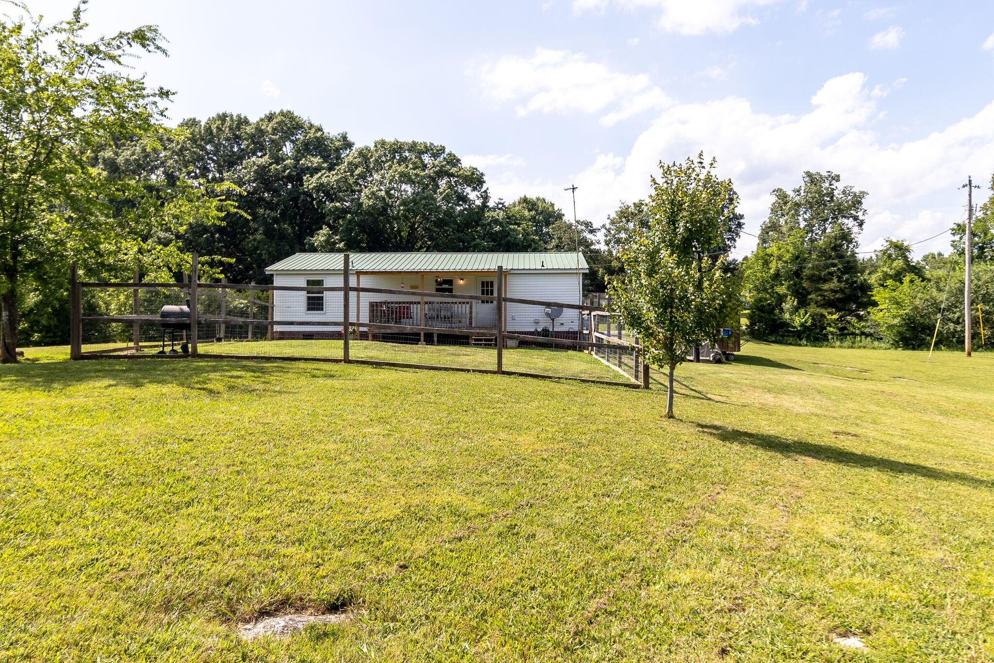 2865 Carpenter Bridge Road Columbia, TN 38401 - Photo 9 of 25 a view of a swimming pool with an outdoor seating and yard