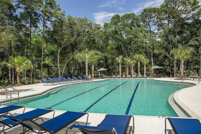 a view of a backyard with sitting area