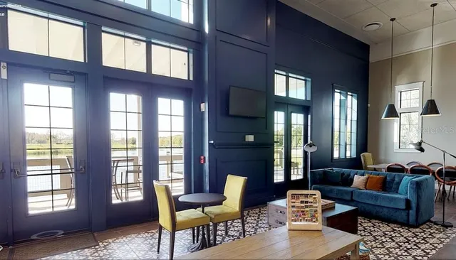 a living room with furniture and windows