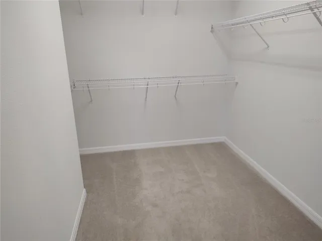 a view of a room with racks on the wall