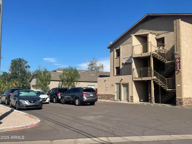 a view of a car parked in front of a house