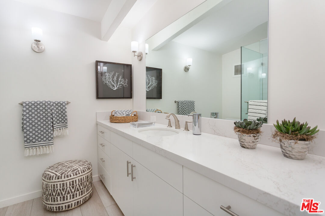 24246 Malibu Road Malibu, CA 90265 - Photo 12 of 20 a bathroom with a sink and a mirror