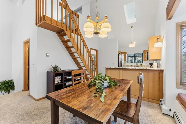 a view of kitchen with furniture and wooden floor