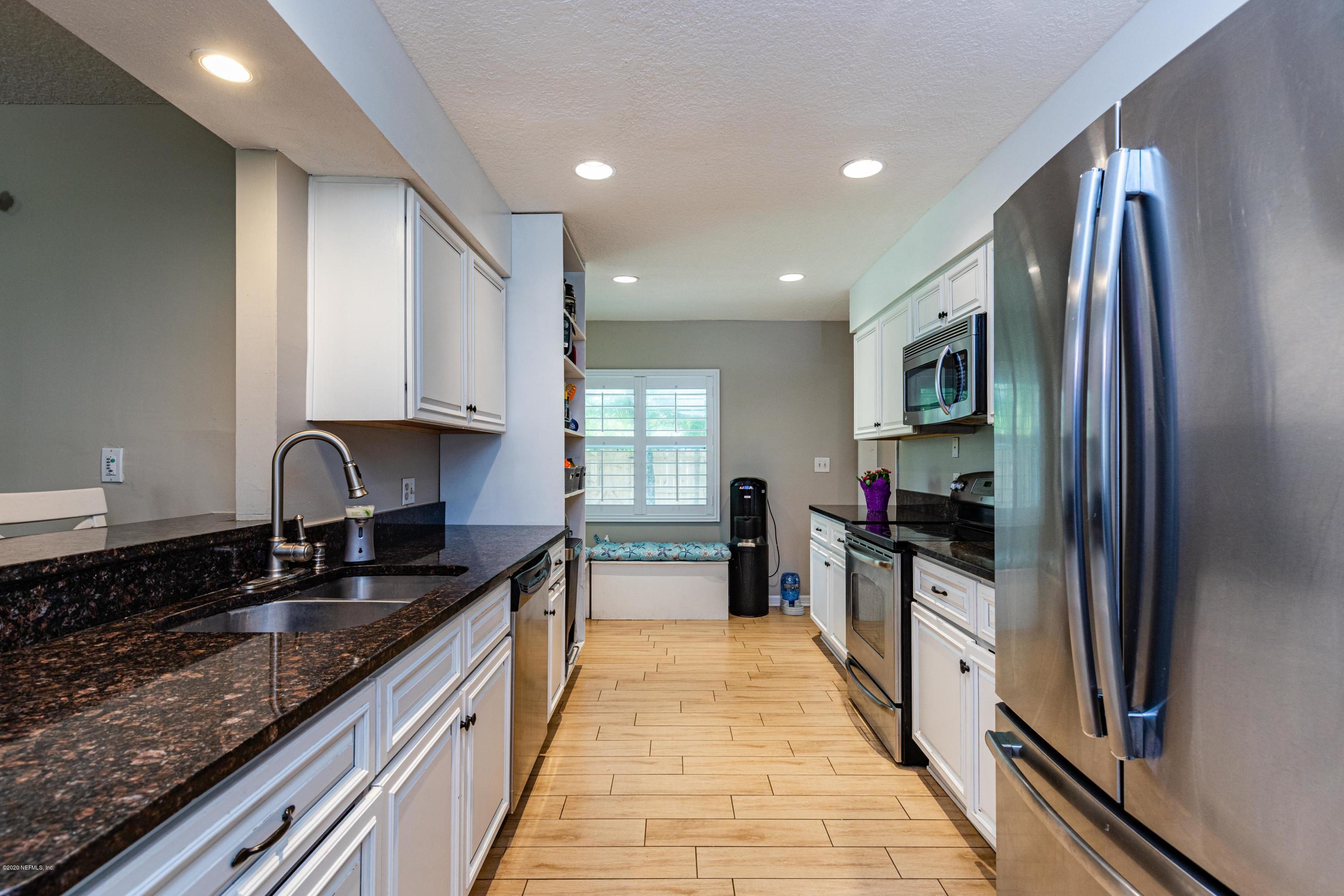 56 Solana Road Ponte Vedra Beach, FL 32082 - Photo 15 of 47 a kitchen with granite countertop a sink and appliances