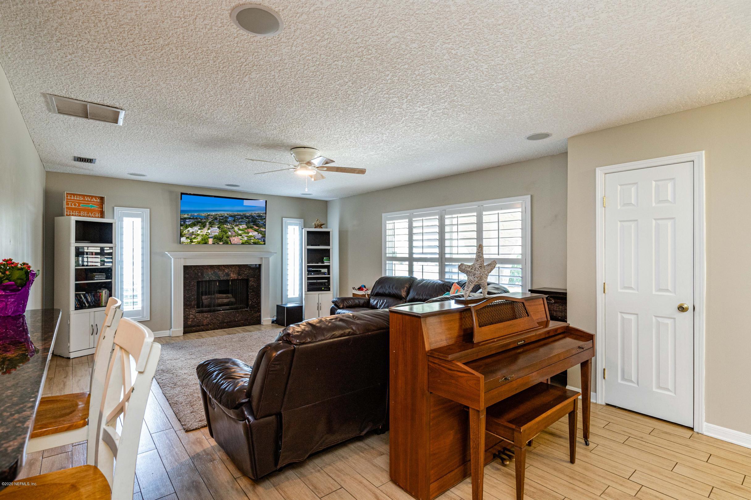 56 Solana Road Ponte Vedra Beach, FL 32082 - Photo 17 of 47 a living room with furniture a fireplace and a window