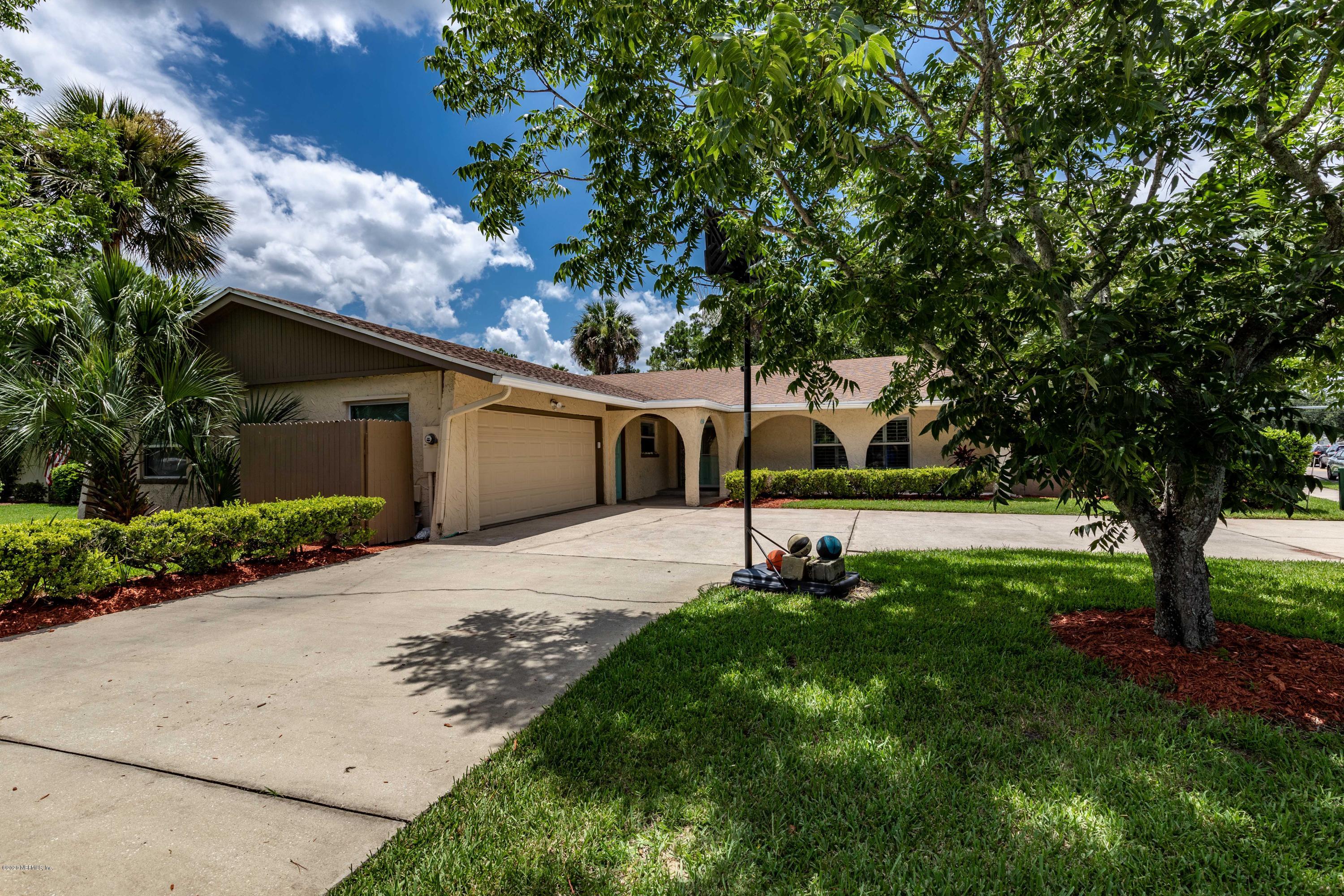 56 Solana Road Ponte Vedra Beach, FL 32082 - Photo 2 of 47 a front view of house with yard and green space