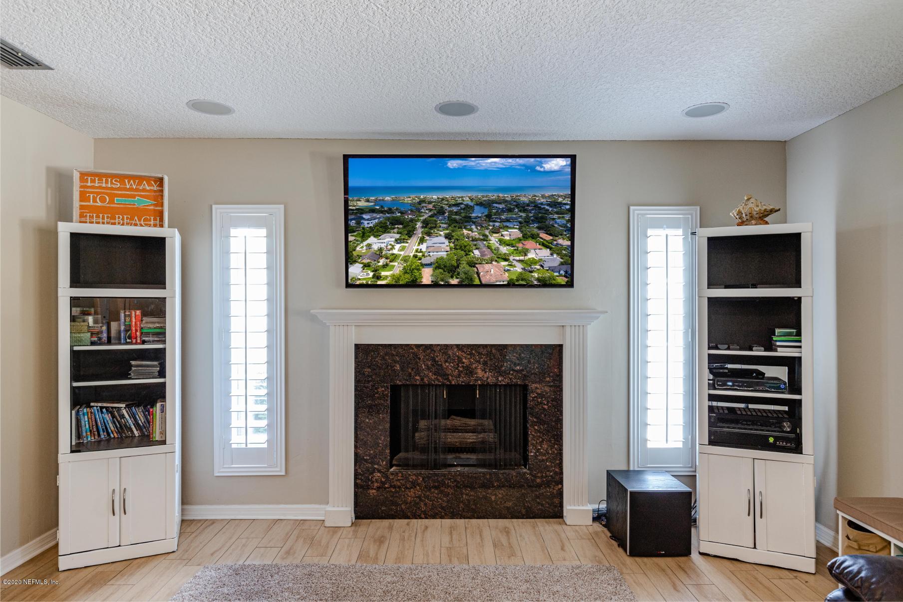 56 Solana Road Ponte Vedra Beach, FL 32082 - Photo 22 of 47 a living room with furniture and a fireplace