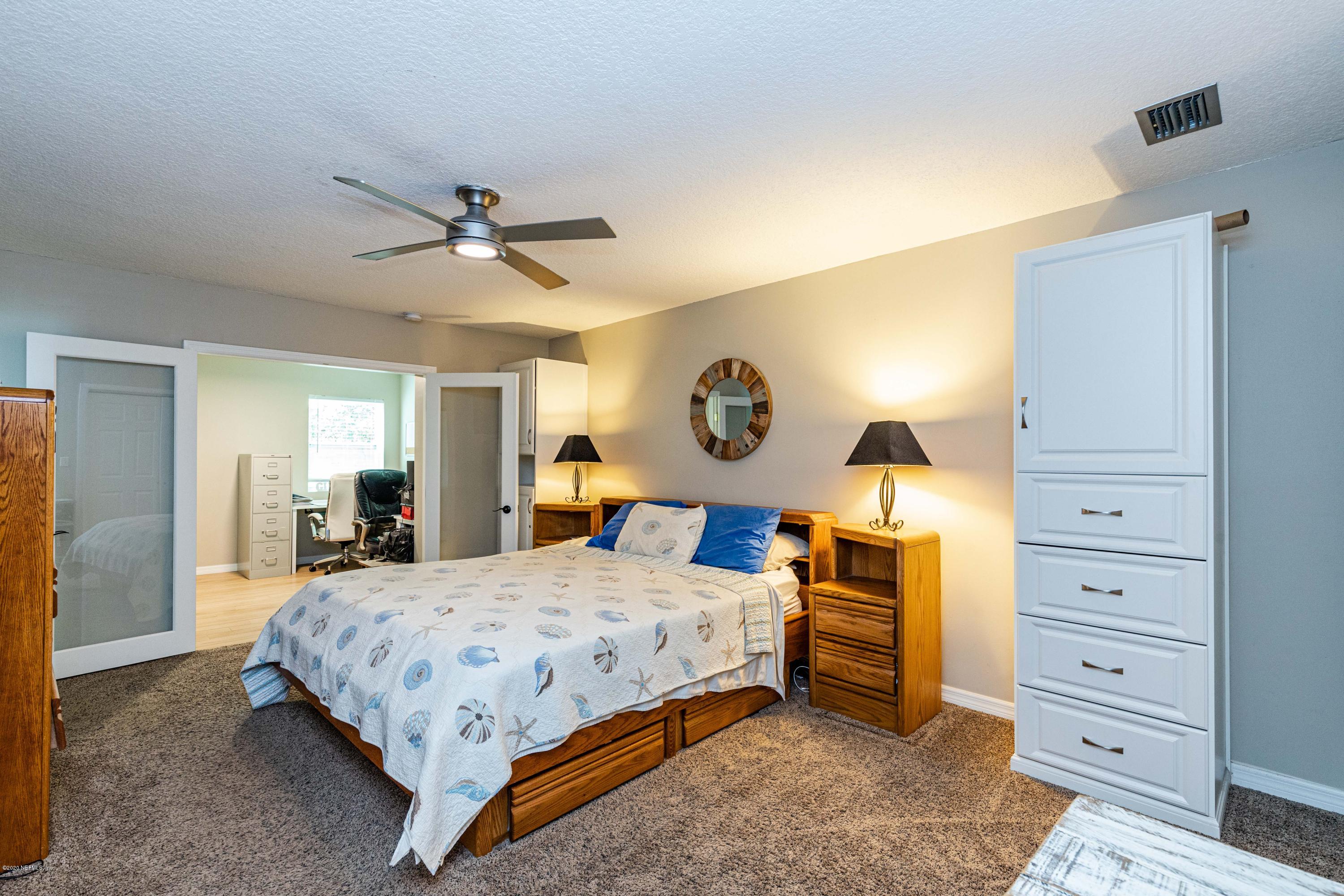56 Solana Road Ponte Vedra Beach, FL 32082 - Photo 23 of 47 a bedroom with a bed and a dresser