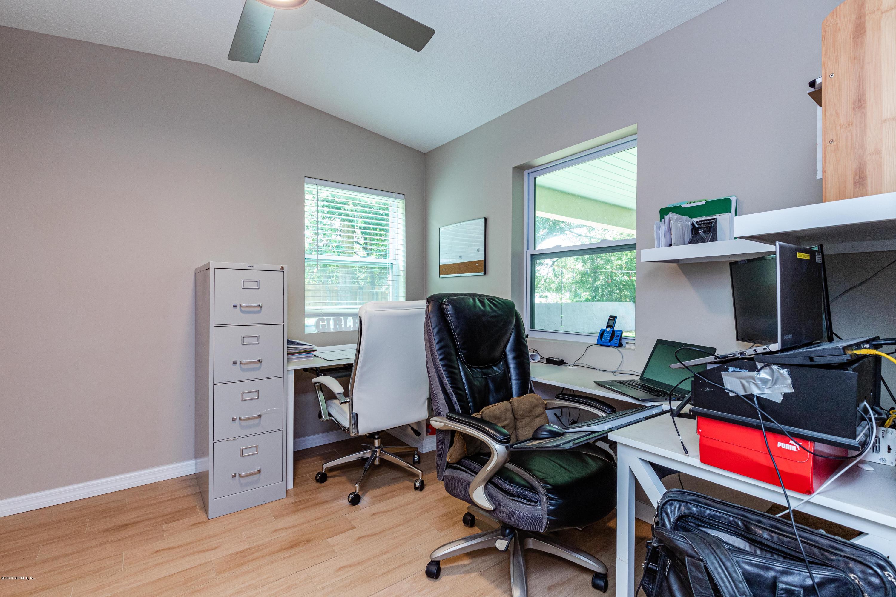 56 Solana Road Ponte Vedra Beach, FL 32082 - Photo 25 of 47 a view of a workspace with furniture and a window