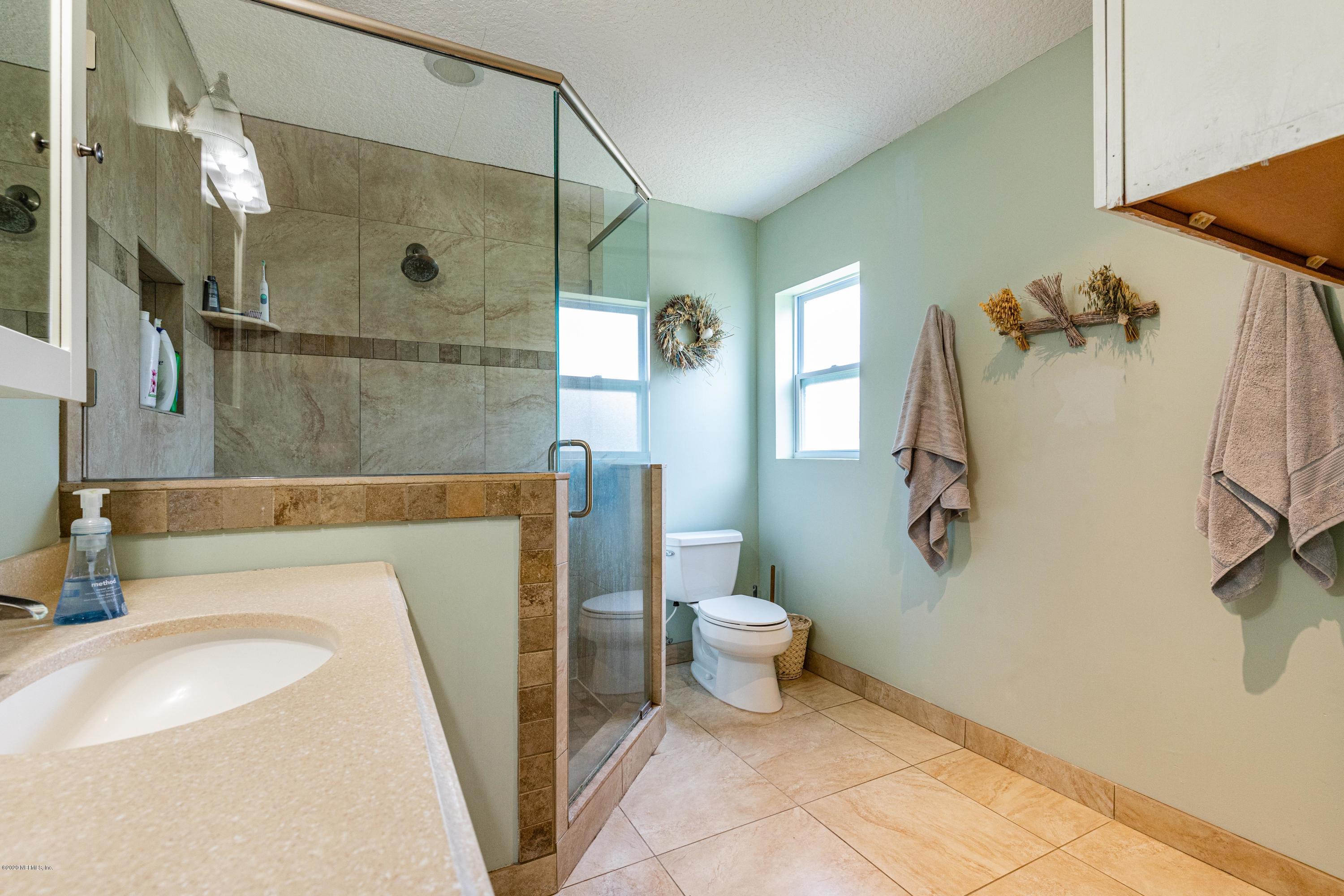 56 Solana Road Ponte Vedra Beach, FL 32082 - Photo 27 of 47 a bathroom with a sink toilet and shower