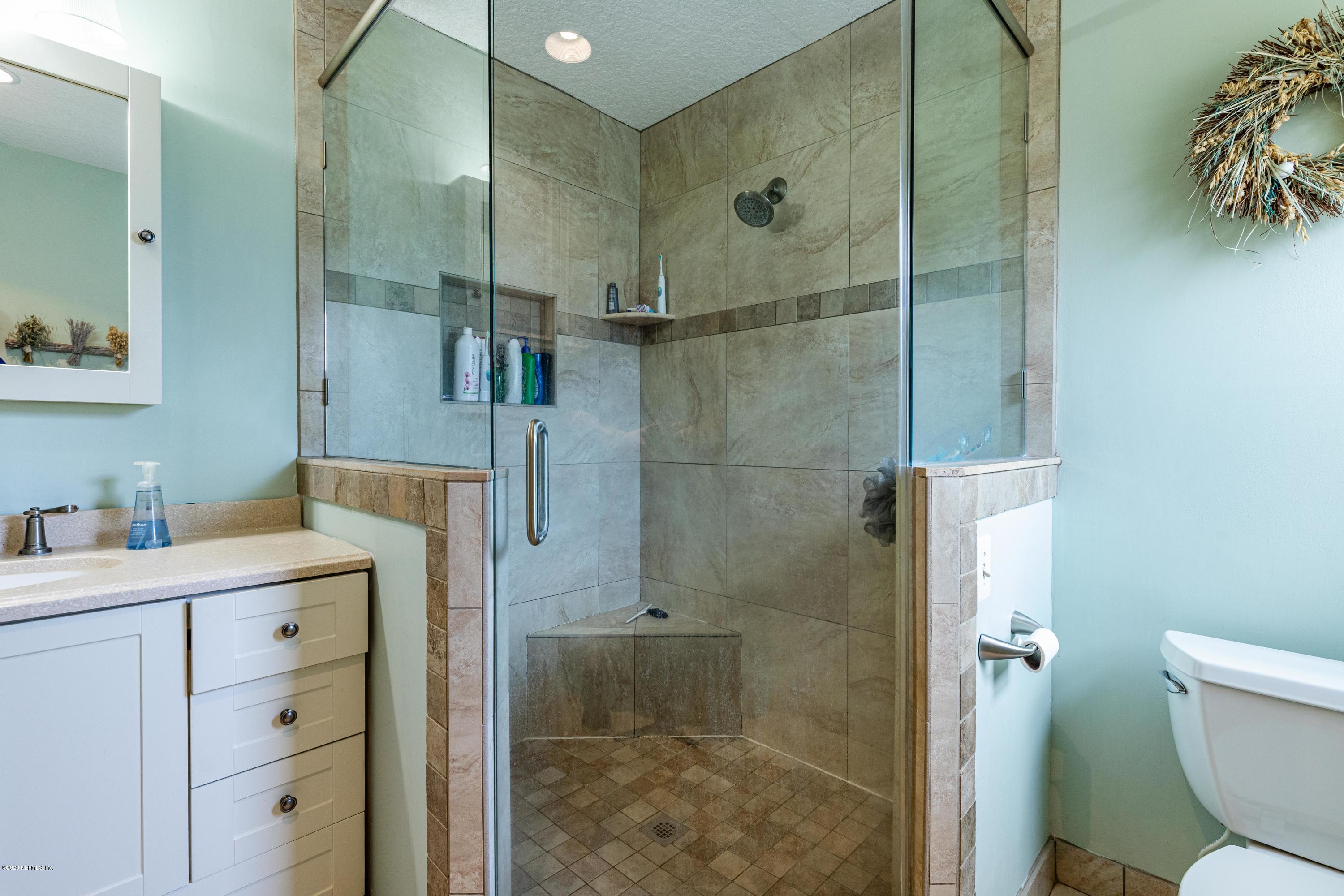 56 Solana Road Ponte Vedra Beach, FL 32082 - Photo 28 of 47 a bathroom with a granite countertop sink a toilet and shower