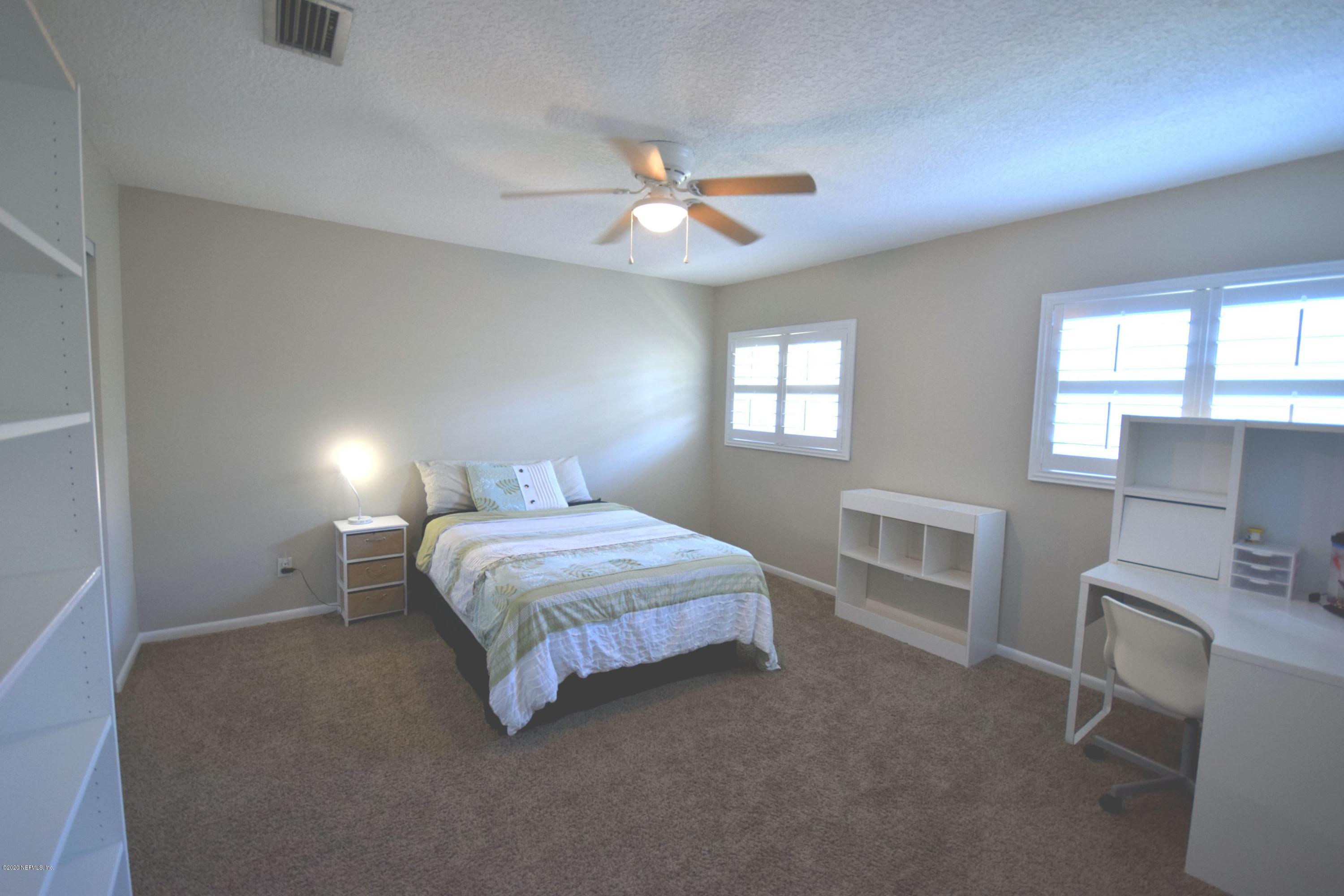 56 Solana Road Ponte Vedra Beach, FL 32082 - Photo 29 of 47 a bedroom with a bed and a window