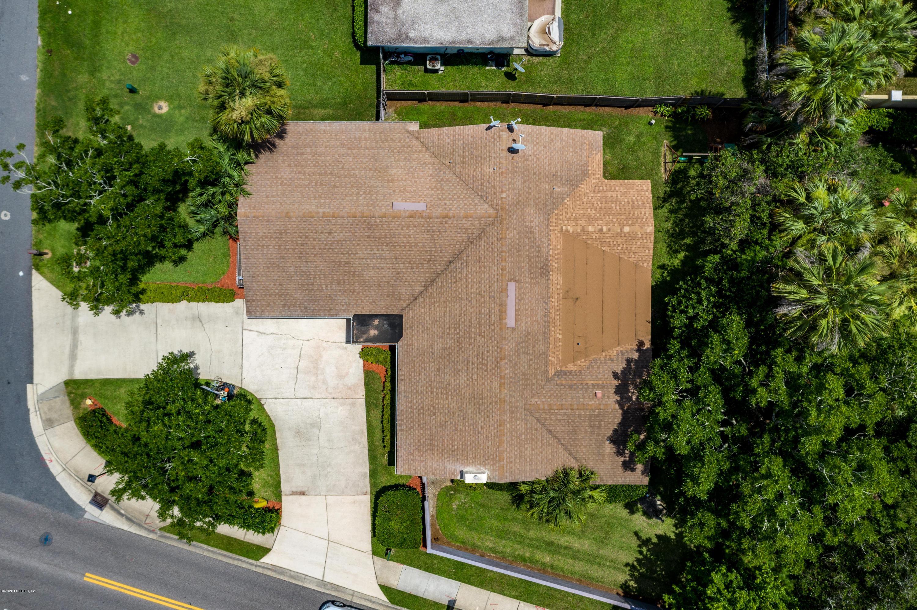 56 Solana Road Ponte Vedra Beach, FL 32082 - Photo 42 of 47 an aerial view of a house with a yard and garden