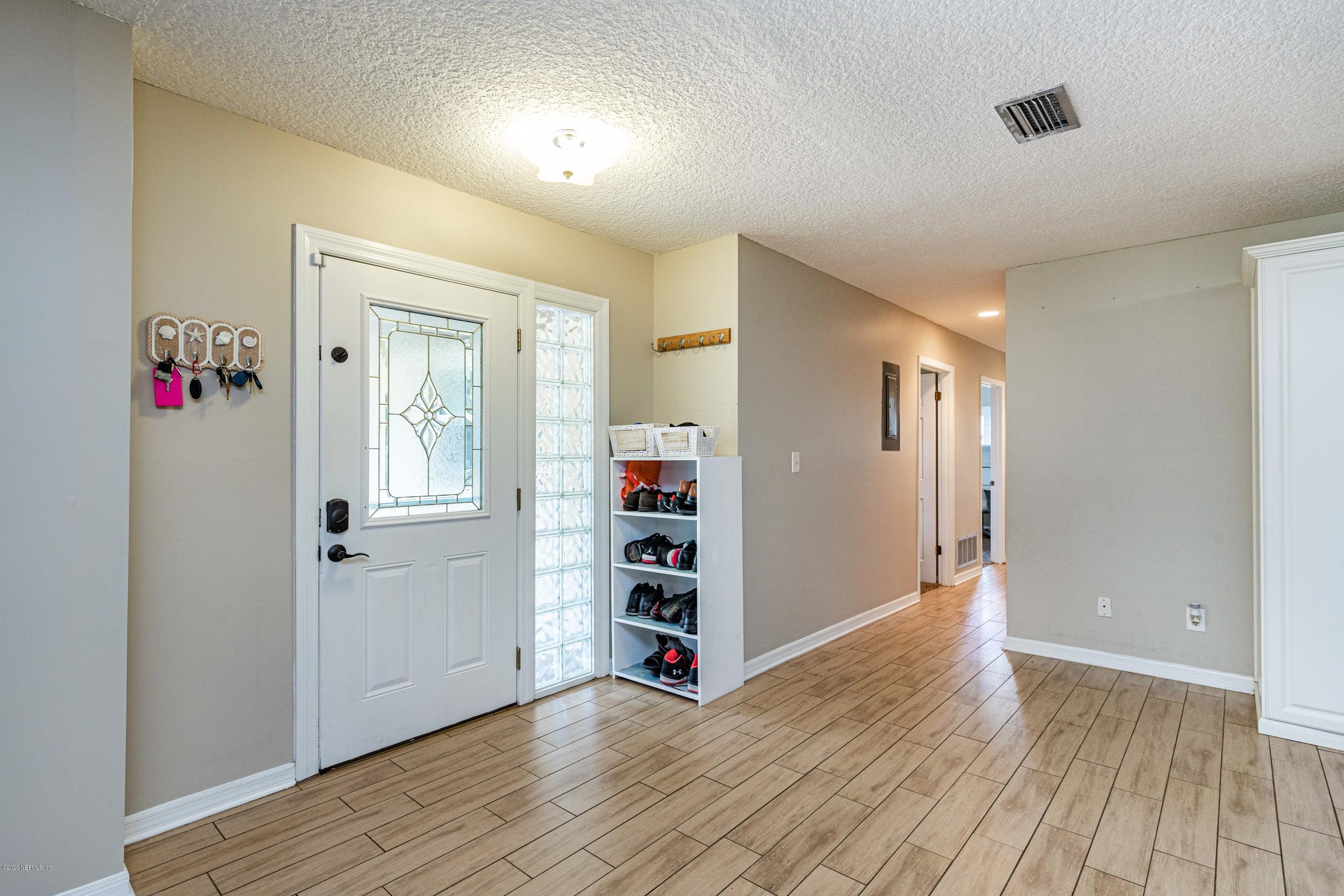 56 Solana Road Ponte Vedra Beach, FL 32082 - Photo 5 of 47 an empty room with wooden floor and closet
