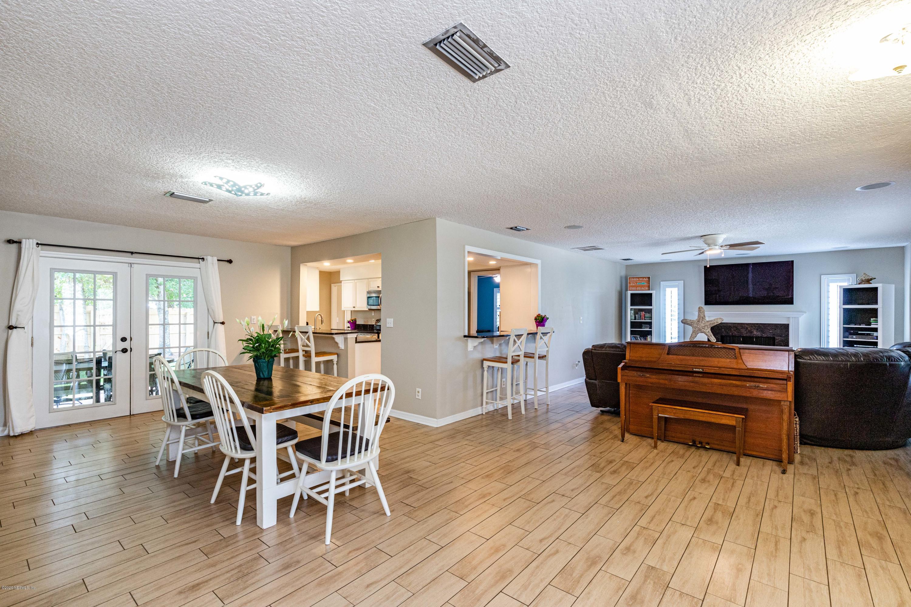 56 Solana Road Ponte Vedra Beach, FL 32082 - Photo 6 of 47 a view of a livingroom with furniture and a flat screen tv
