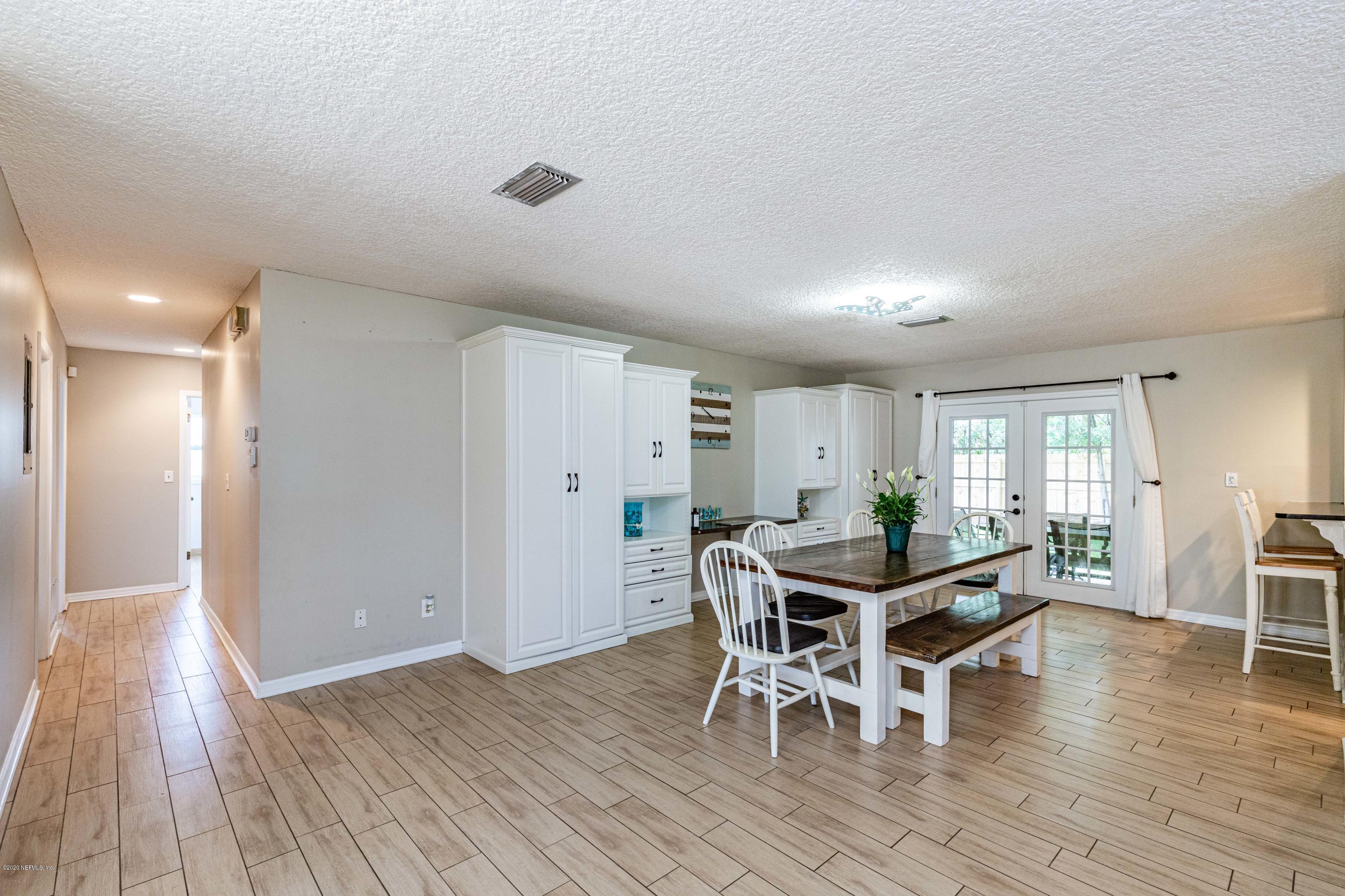 56 Solana Road Ponte Vedra Beach, FL 32082 - Photo 7 of 47 a view of a dining room with furniture and wooden floor