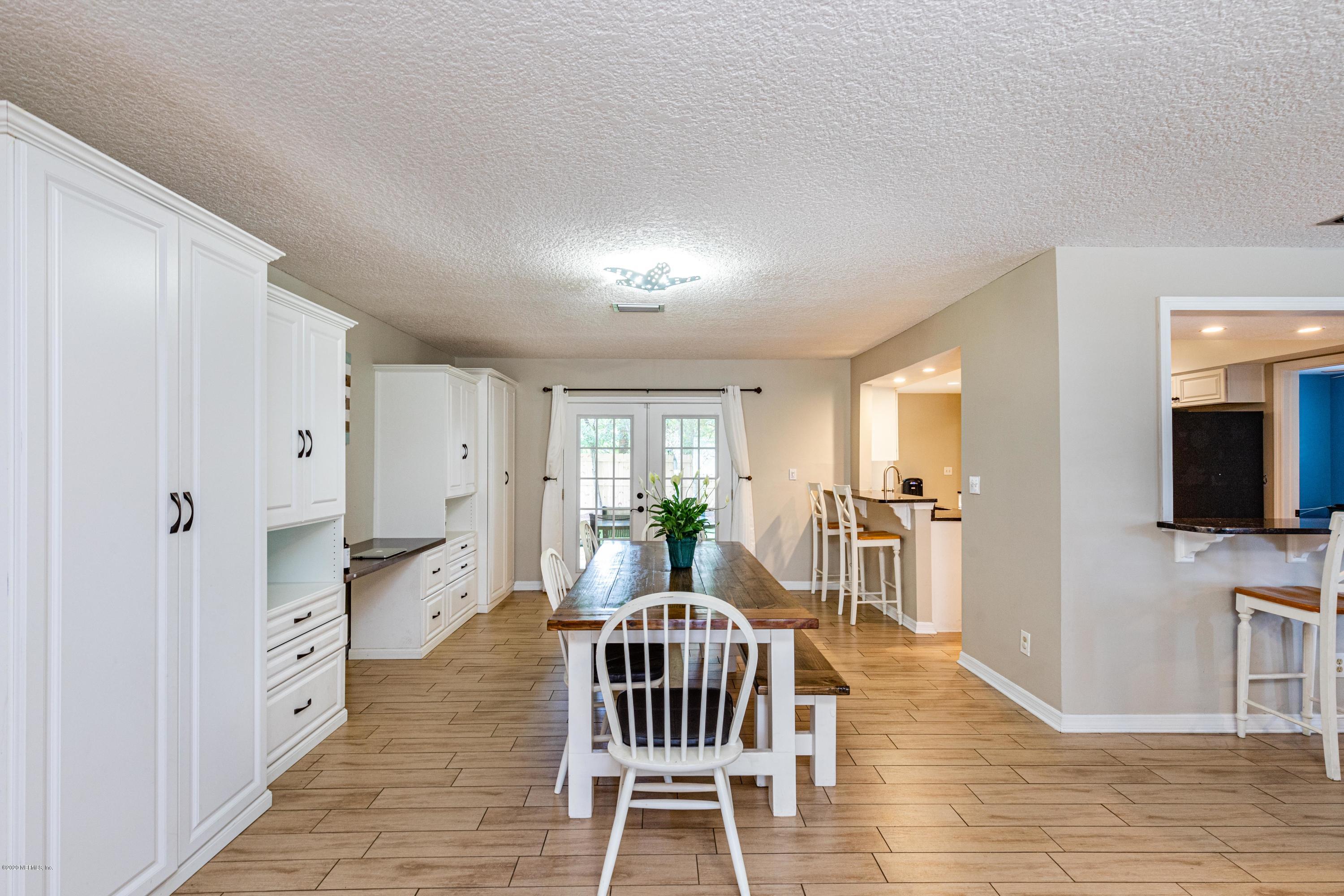 56 Solana Road Ponte Vedra Beach, FL 32082 - Photo 8 of 47 a living room with furniture a flat screen tv and a fireplace