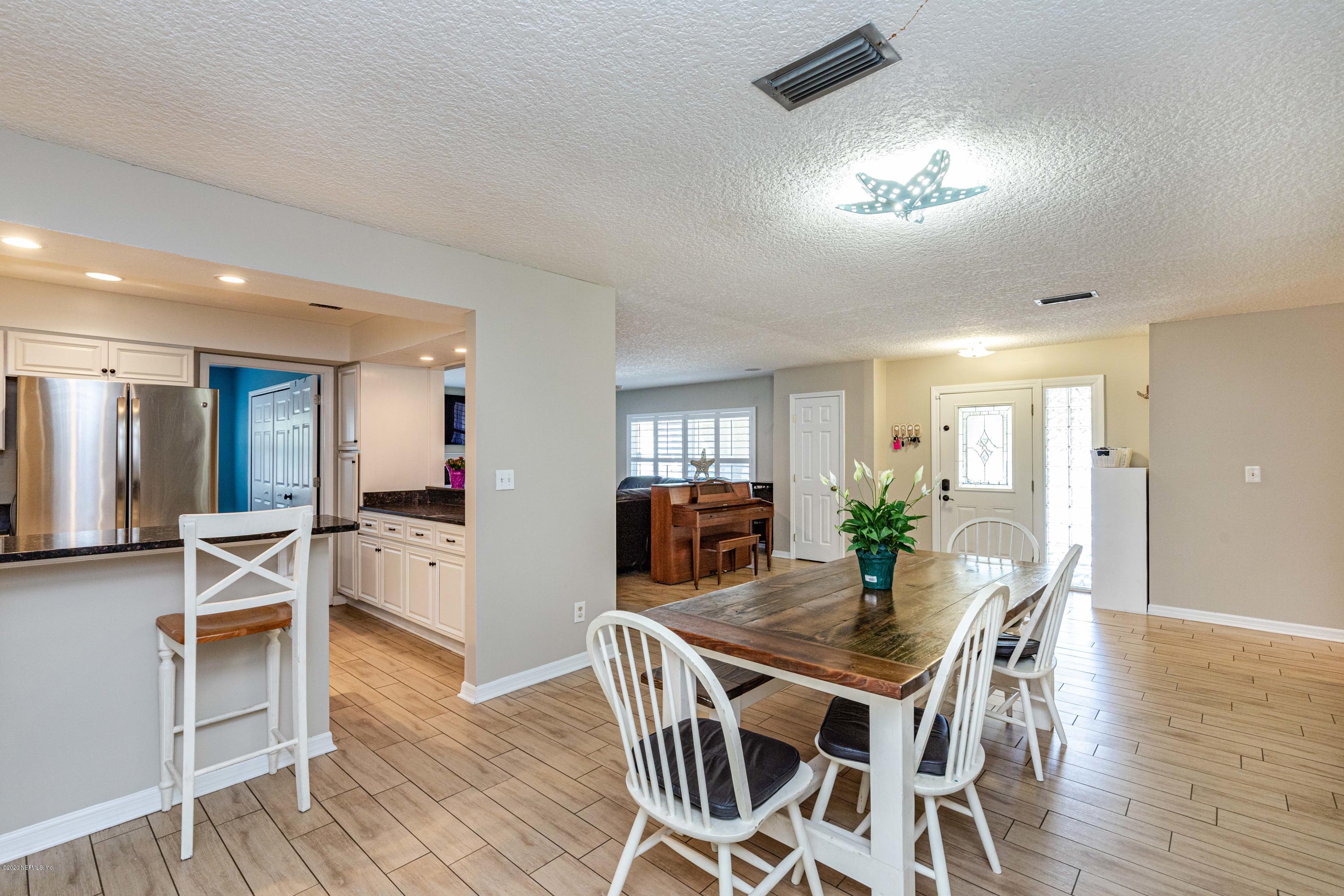 56 Solana Road Ponte Vedra Beach, FL 32082 - Photo 9 of 47 a view of a dining room with furniture and wooden floor