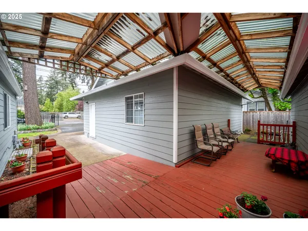 a roof deck with table and chairs