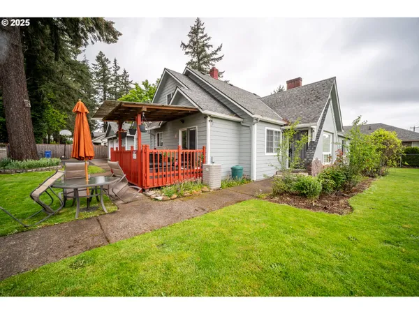 a front view of a house with a yard and porch