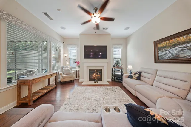 a living room with furniture a window and a fireplace