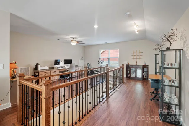 a view of a livingroom with furniture and hardwood floor