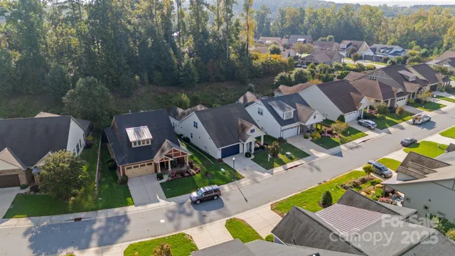an aerial view of a house with a garden