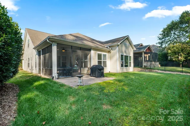 an aerial view of a house with a garden and trees