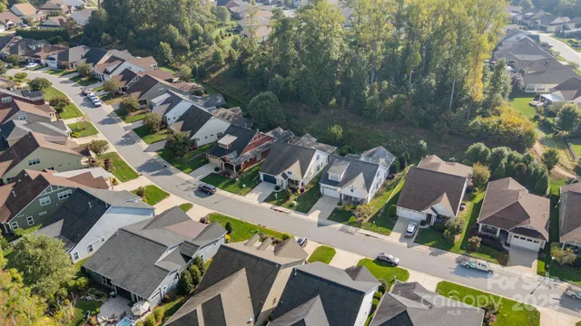 a front view of a house with garden and porch
