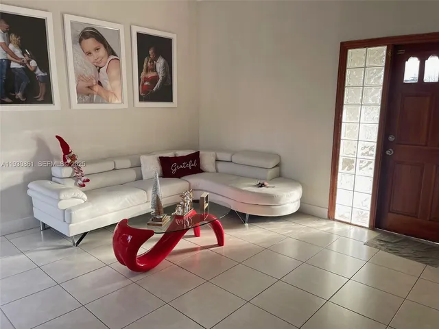 a living room with furniture and window